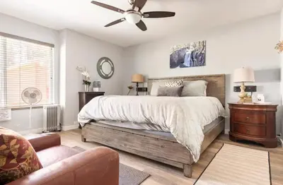 a bedroom with a bed and a ceiling fan at Sunshine Village 145 in Mammoth Lakes