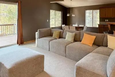 a living room with a couch and a table at High Sierra Hideaway in South Lake Tahoe