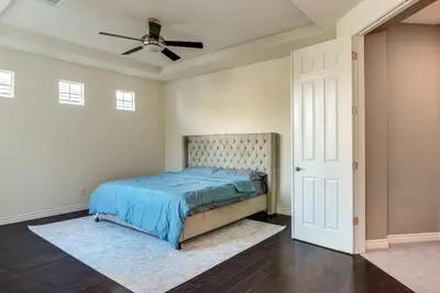 a bedroom with a bed and a ceiling fan at Near Wineries and Parks Waterfront Tracy Getaway! in Tracy