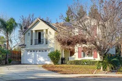 a white house with a white garage at Near Wineries and Parks Waterfront Tracy Getaway! in Tracy