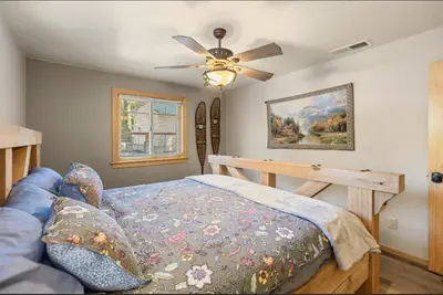 a bedroom with a bed and a ceiling fan at Big Foot Hide Out Shaver Lake Mts in Shaver Lake