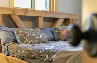 a bunk bed with pillows on it in a room at Big Foot Hide Out Shaver Lake Mts in Shaver Lake