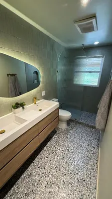 a bathroom with a sink and a toilet and a mirror at Quiet retreat - Hot tub & sauna in Three Rivers in Three Rivers