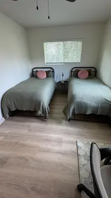 a bedroom with two beds with pillows on them at Quiet retreat - Hot tub & sauna in Three Rivers in Three Rivers
