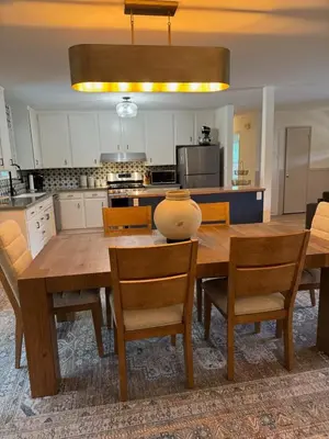 a kitchen with a wooden dining room table and chairs at Quiet retreat - Hot tub & sauna in Three Rivers in Three Rivers