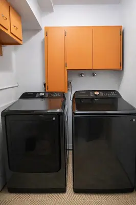 a kitchen with a stove and a microwave at Chamberland retreat-Hot Tub, Pool Table, Movie & Ski in Homewood