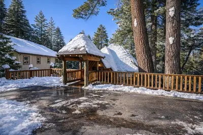 a house with a gazebo in the snow at Strawberry Chalet Near Pinecrest & Dodge Ridge in Strawberry