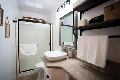 a bathroom with a sink and a toilet and a mirror at Strawberry Chalet Near Pinecrest & Dodge Ridge in Strawberry
