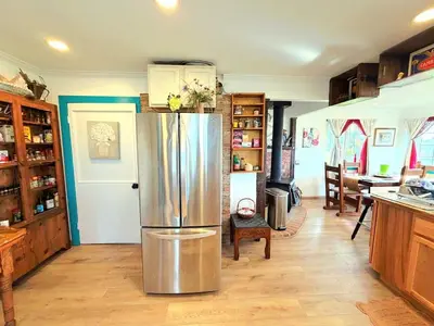 a kitchen with a stainless steel refrigerator in it at Hot Tub, Farm Chic Shingle Springs Birders Heaven in Shingle Springs