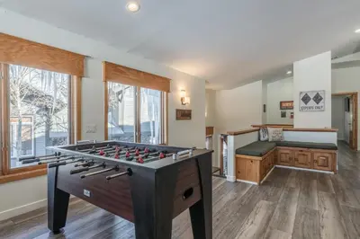 a game room with a foosball table and a tub at Snowcreek 704 in Mammoth Lakes