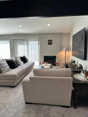 a living room with two couches and a fireplace at The gorgeous in Citrus Heights