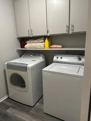 a white washer and dryer in a small kitchen at The gorgeous in Citrus Heights