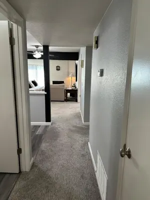 an empty room with a hallway leading to a living room at The gorgeous in Citrus Heights