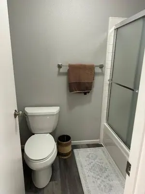 a bathroom with a toilet and a shower at The gorgeous in Citrus Heights