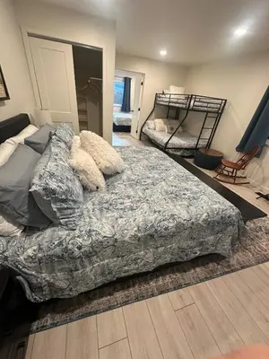 a bedroom with a bed and two bunk beds at Hidden Gem House incredible location remodeled in South Lake Tahoe