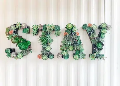 a word made out of plants on a wall at Yosemite Boho Bungalow, Pet Friendly & Mtn Views! in Coarsegold
