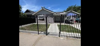 a black fence in front of a house at 35th Avenue room for rent in Sacramento