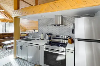 a kitchen with a stove and a refrigerator at Yosemite Escape in White Wolf