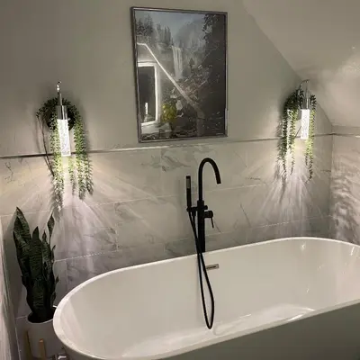 a white bath tub in a bathroom with plants at Yosemite Escape in White Wolf