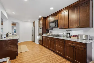 a kitchen with wooden cabinets and a counter top at Yosemite Spirit in White Wolf