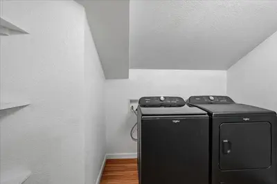 a small black refrigerator in a corner of a room at Yosemite Spirit in White Wolf