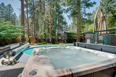 a hot tub in a backyard with a roller coaster at Beach and Skiing at Zephyr Cove house in Zephyr Cove