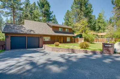 a house with a garage and a driveway at Beach and Skiing at Zephyr Cove house in Zephyr Cove