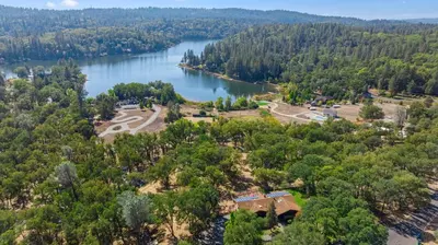 an aerial view of a park next to a lake at Cozy Lake View 4Bd 2,5Br Retreat in 5 Acres, Hot Tub and more in Auburn