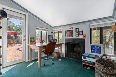 a home office with a desk and a fireplace at Cozy Lake View 4Bd 2,5Br Retreat in 5 Acres, Hot Tub and more in Auburn