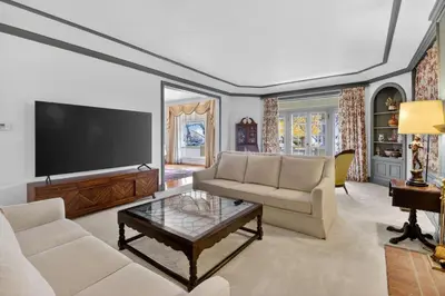 a living room with a tv and a couch and a table at The Spalding House Comfort in Visalia home in Visalia