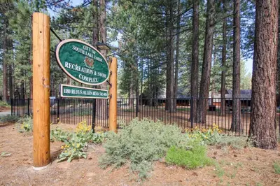 a sign for a park next to a fence at Lakeview Luxury Getaway in South Lake Tahoe