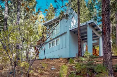 a house in the woods with trees at Lakeview Luxury Getaway in South Lake Tahoe