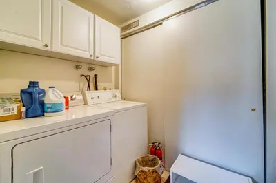 a kitchen with white cabinets and a white dishwasher at Walk to Lake Tahoe Family Retreat with Deck! in Incline Village