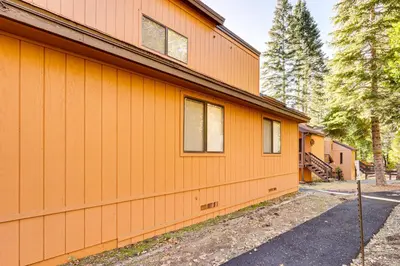 a building with an orange wall at Community Perks and Watercrafts Shaver Lake Condo in Shaver Lake