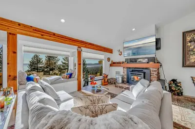 a living room with a couch and a fireplace at Incline Village Views - Pellet Stove Deck in Incline Village