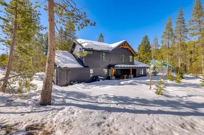 a house in the woods in the snow at Steps From Sledding Hill! Soda Springs Mtn Retreat in Soda Springs