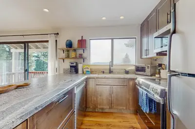 a kitchen with wooden cabinets and a large counter top at Spectacular Lake Views in Tahoe City