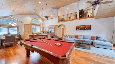 a living room with a pool table at 2 Truckee Cabin • Sleeps 20 • Hot tub • Games • Near Donner Lake Donner Ridge Alplenglow Chalet by AvantStay in Truckee