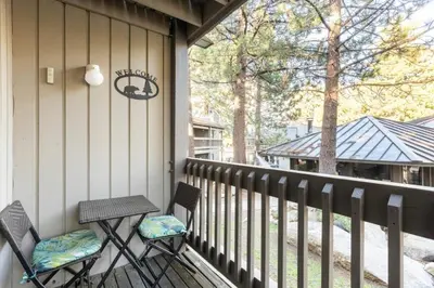 two chairs and a table on a porch at Sierra Park Villas 28 in Mammoth Lakes