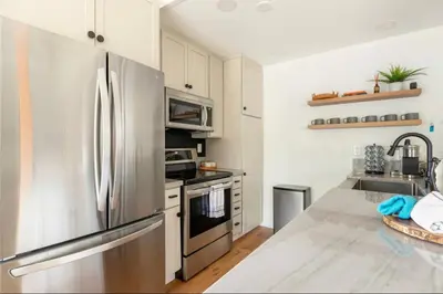 a kitchen with a stainless steel refrigerator at Seasons Four 152 in Mammoth Lakes