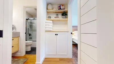 a bathroom with a closet with a white door at Seasons Four 152 in Mammoth Lakes
