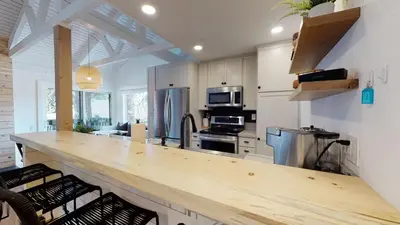 a kitchen with a wooden counter top in a room at Seasons Four 152 in Mammoth Lakes