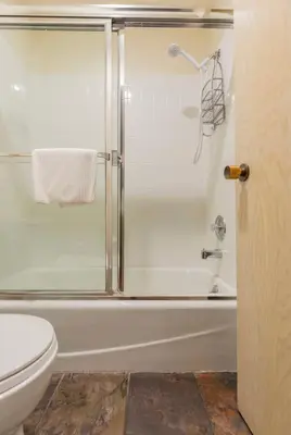 a bathroom with a shower and a toilet at Snowcreek 569 in Mammoth Lakes