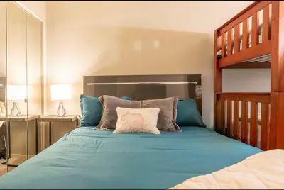a bedroom with a bed with a bunk bed at Snowcreek 569 in Mammoth Lakes