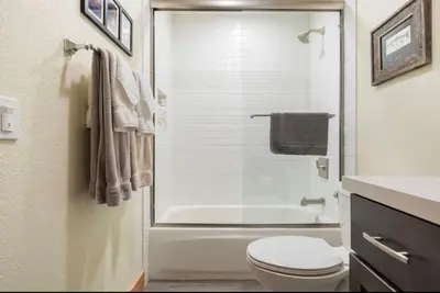 a bathroom with a tub and a toilet and a sink at Mammoth Sierra Townhome 1 in Mammoth Lakes