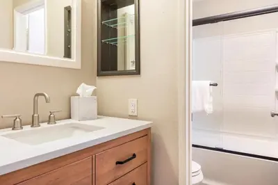 a bathroom with a white sink and a shower at Mammoth Ski and Racquet 116 in Mammoth Lakes