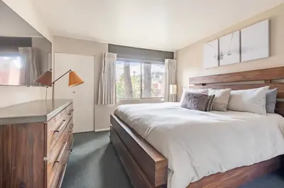 a bedroom with a large bed and a large window at Mammoth Ski and Racquet 116 in Mammoth Lakes
