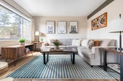 a living room with a couch and a table at Mammoth Ski and Racquet 116 in Mammoth Lakes