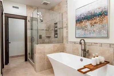 a bathroom with a white tub and a shower at Timbers 1057 in Mammoth Lakes