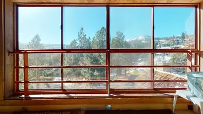 a large window with a view of a mountain at Aspen Creek 230 in Mammoth Lakes